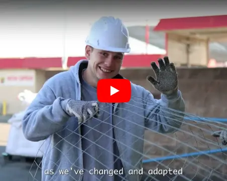 Photo of an individual smiling and waving at the Value Village Thrift Store